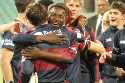 An ecstatic Sekou Shangase hugs Kaeden McAllister after McAllister had steered Westville to the W100 title.