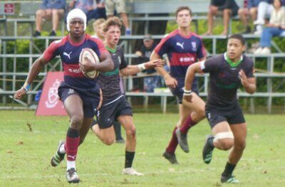Westville centre Michael Satade heads for the try line after making a clean break through Pearson's defensive line.