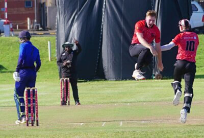 The bowler, Tim Saulez, and wicketkeeper, Lawson Dinsdale, celebrate the wicket of David de Bruyn on the first ball of Northwood's innings. Photo: Brad Morgan.
