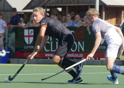 Clifton hockey captain Zach Williamson drives his team forward against St Alban's, 10 May 2025, Riverside Sports Club, Durban. Photo: Brad Morgan.