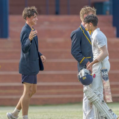 DHS opener Ismaeel Omar is congratulated by his teammates after scoring an unbeaten century in School's win over Hilton College. Photo: Justin Waldman Sports Photography.