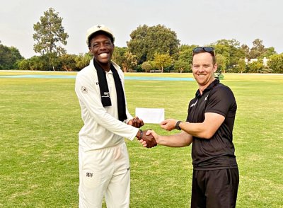 Barack Munawa had plenty to be happy about after batting Hilton College to a win over St David's Marist Inanda, which won him the man of the match award, presented by Carl Schmidt. Photo: Supplied.